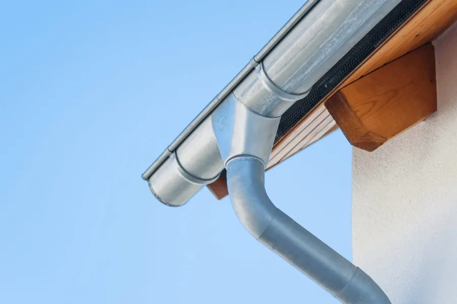 Precision Gutters LLC aluminum gutter and downspout installation on residential roof