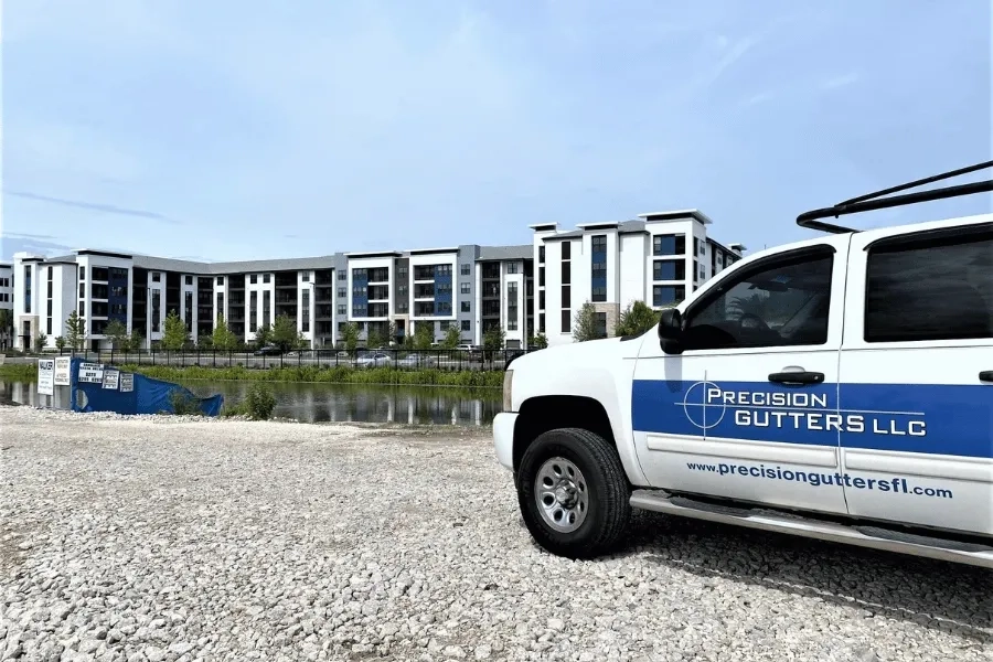 Precision Gutters LLC commercial gutter installation at modern apartment complex