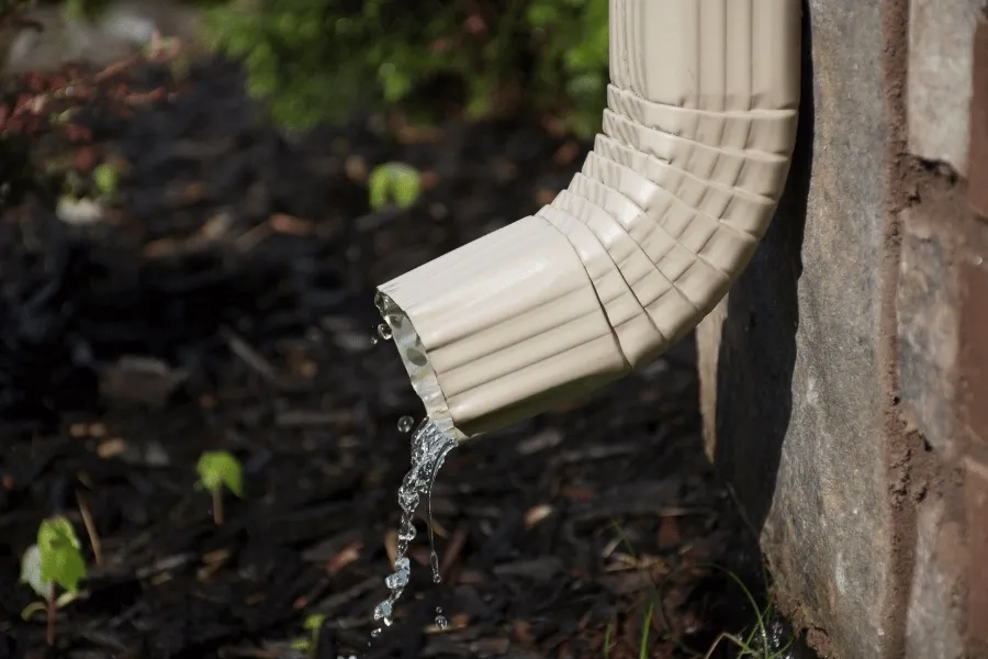 Precision Gutters LLC residential gutter downspout directing rainwater drainage