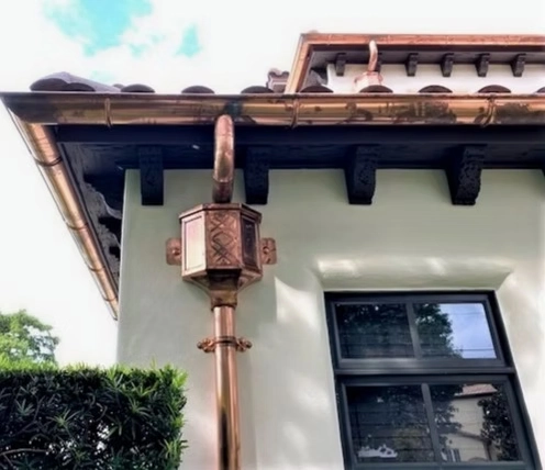 Precision Gutters custom copper gutter installation on luxury residential home exterior in Orlando, Florida
