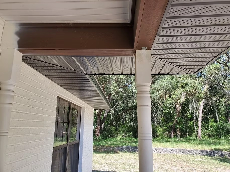 Soffit and fascia service in Orlando featuring ventilated soffit installation on residential home exterior