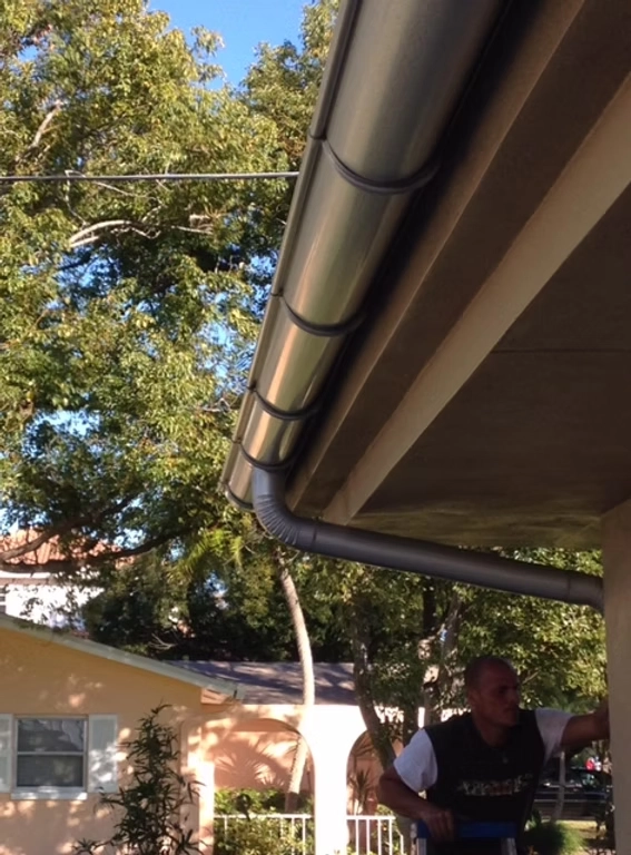Professional seamless aluminum gutter system installed by Precision Gutters LLC on residential property