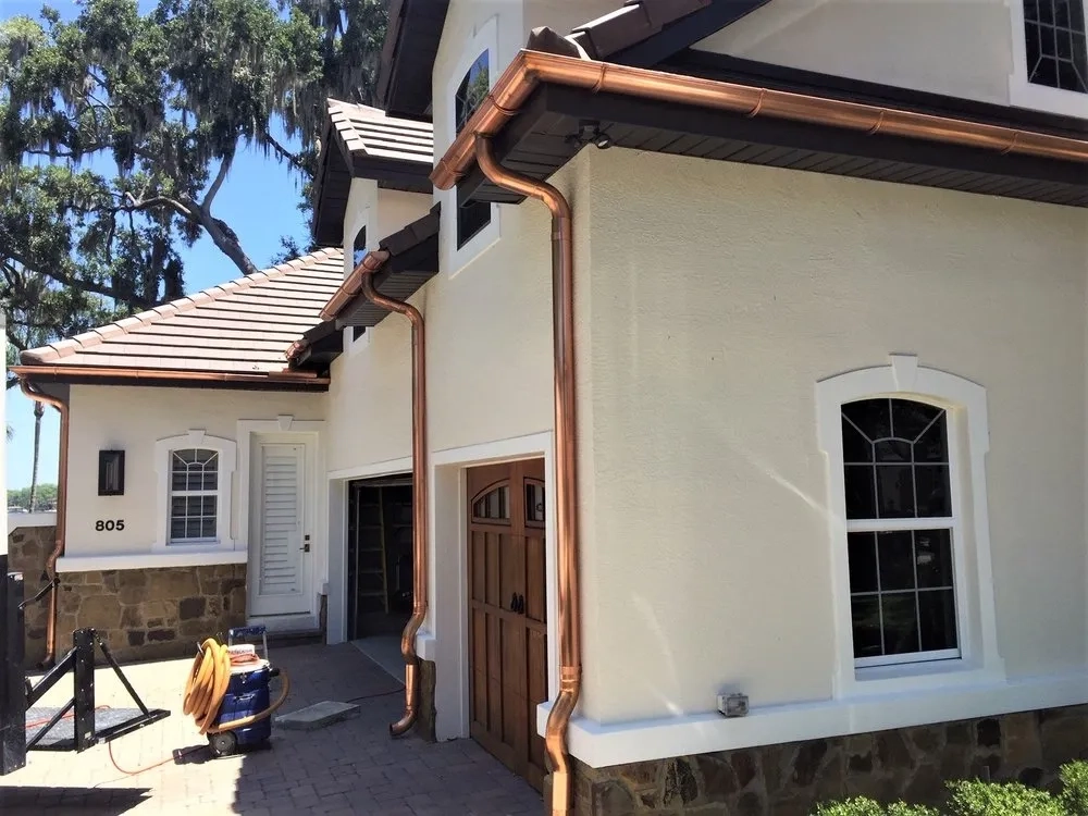 Custom copper gutter system installed on upscale residential property