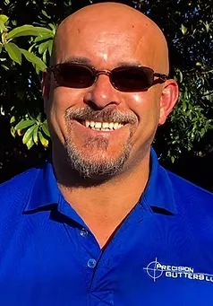 Den Santos, Fort Lauderdale Branch Manager at Precision Gutters FL, helping homeowners with professional gutter installation and customer service.